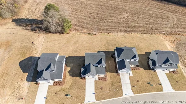 a view of a workspace with furniture and a potted plant
