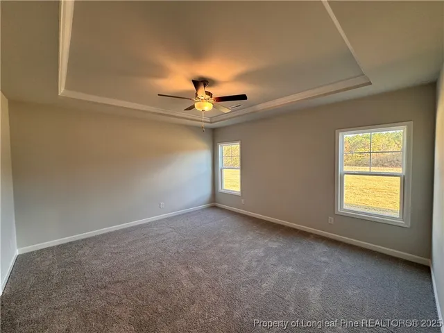 a bathroom with a double vanity sink a large mirror and shower
