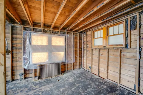 a view of a white house with a yard