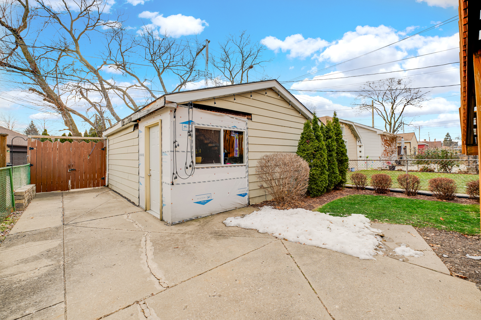 6025 West Matson Avenue Chicago, IL 60646 - Photo 15 of 19 a view of a white house with a yard