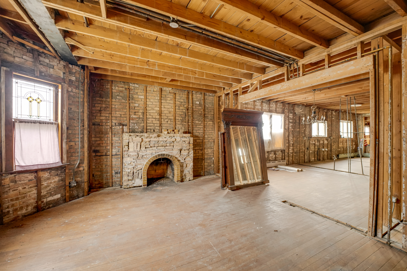 6025 West Matson Avenue Chicago, IL 60646 - Photo 3 of 19 a view of an empty room with fireplace and windows