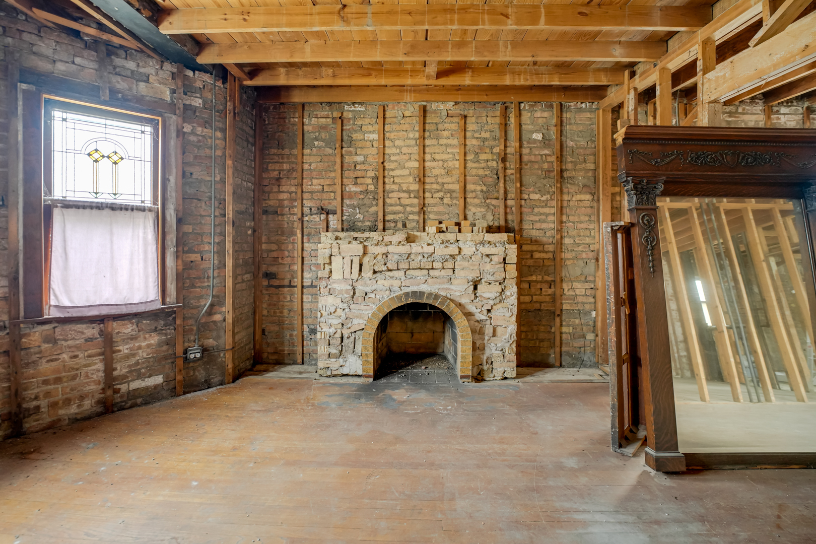 6025 West Matson Avenue Chicago, IL 60646 - Photo 4 of 19 a view of an empty room with fireplace and a window
