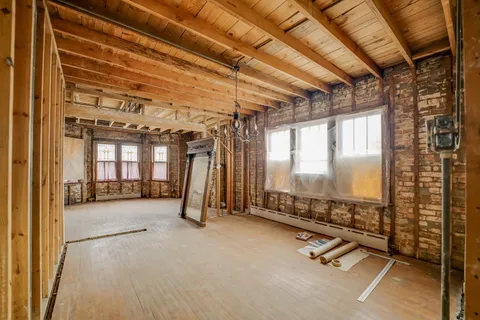 a room with gym equipment and a large window