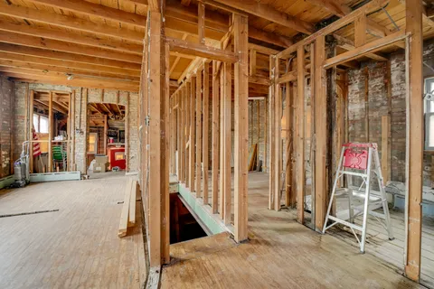 a view of a room with wooden walls