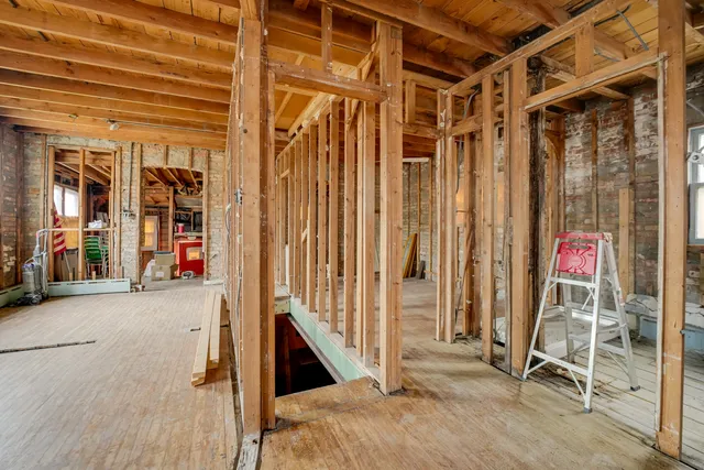 a view of a room with wooden walls