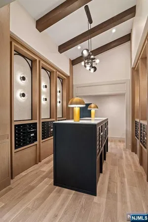 a view of a living room and kitchen