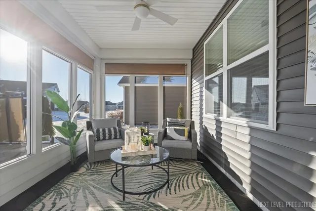 a living room with furniture a table and a window