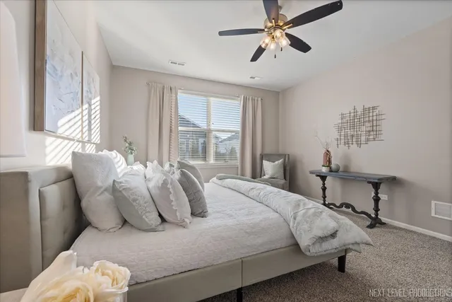 a bathroom with double sink and a mirror