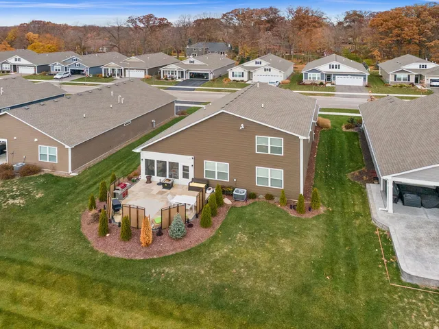 a aerial view of a house with a big yard
