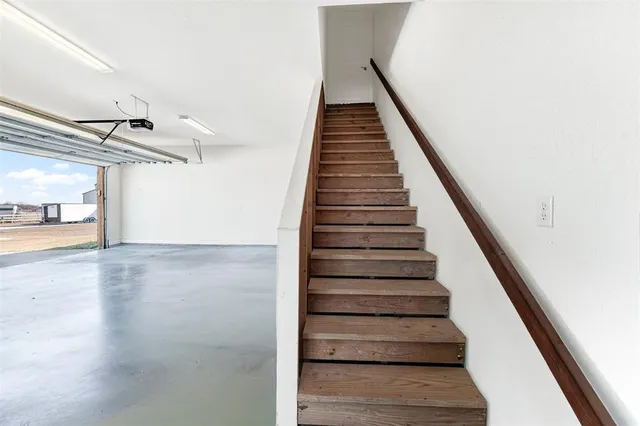 a view of a garage with a lot of stuff