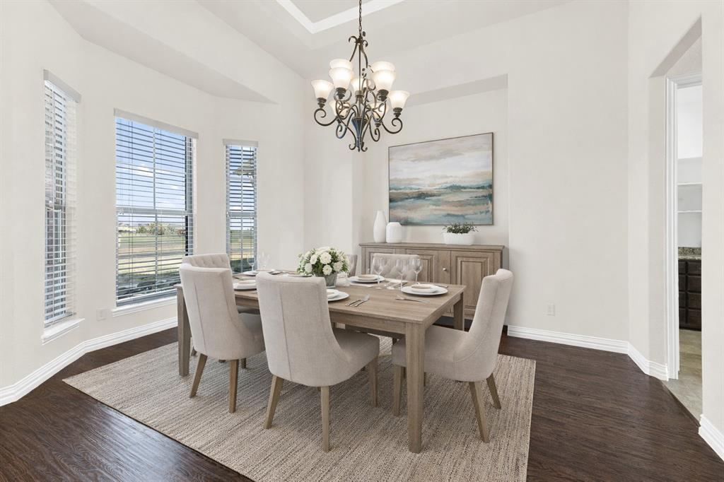 834 Audra Circle Rhome, TX 76078 - Photo 4 of 33 a dining room with furniture a large window and wooden floor