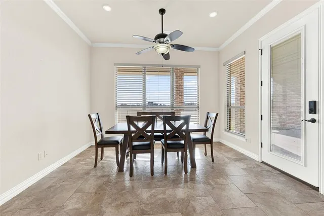 a view of a dining room with furniture and window