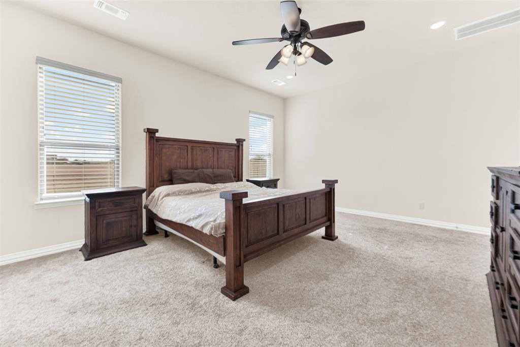 834 Audra Circle Rhome, TX 76078 - Photo 10 of 33 a bedroom with a bed and window