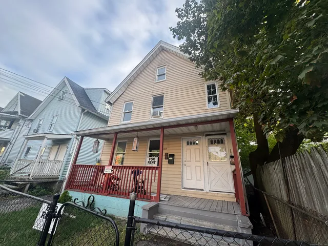 a front view of a house with garage