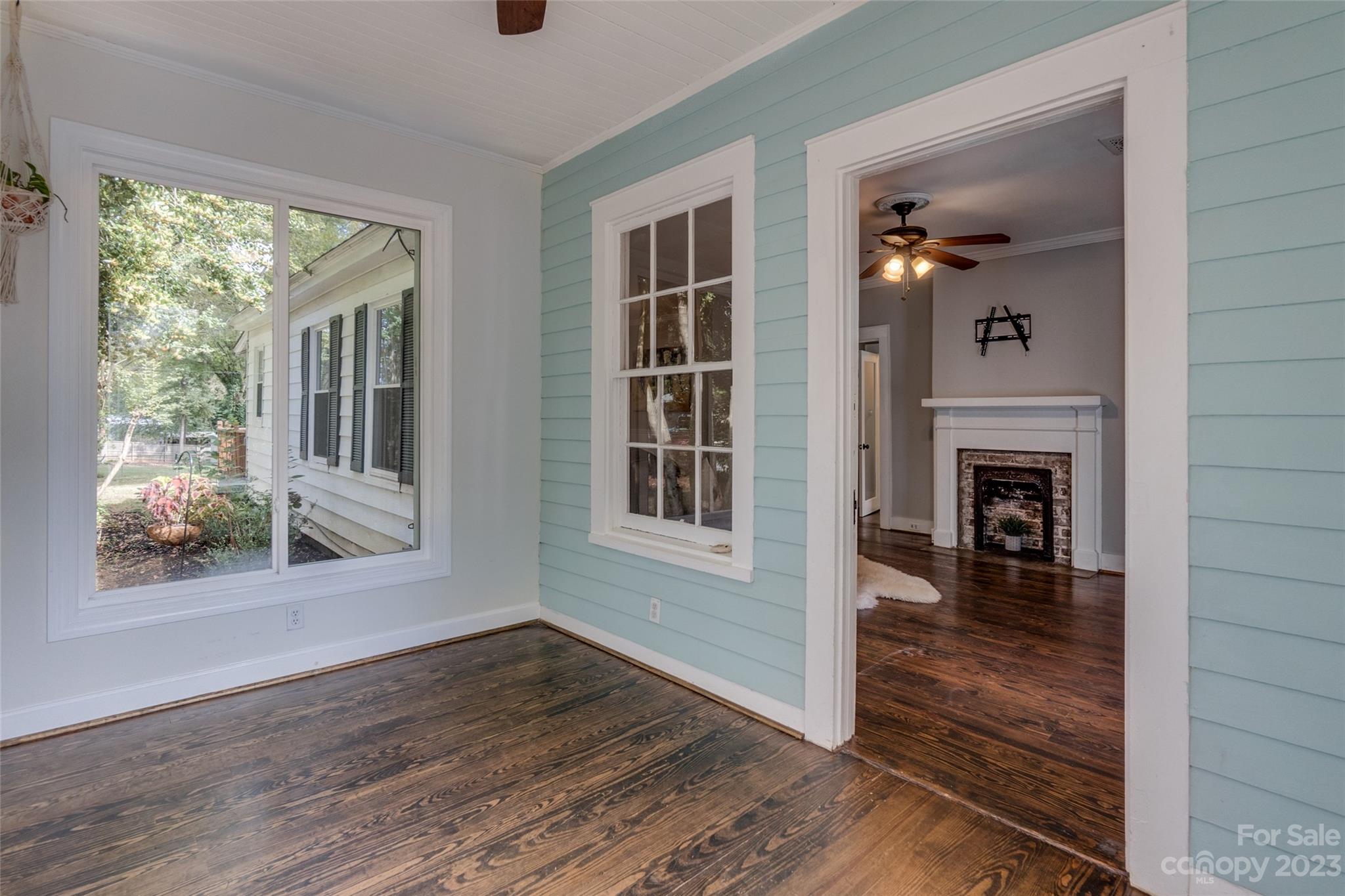 102 Grier Street Fort Mill, SC 29715 - Photo 11 of 47 a view of a livingroom with wooden floor and windows