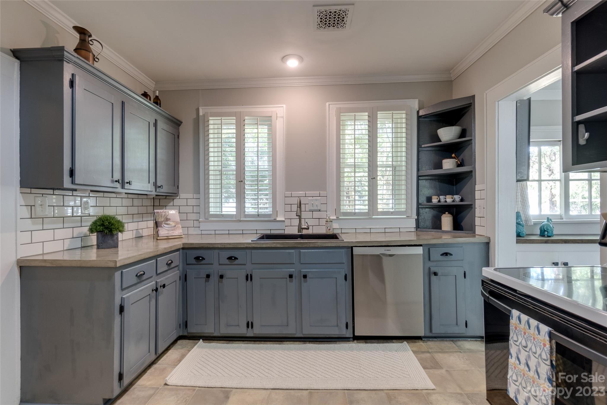 102 Grier Street Fort Mill, SC 29715 - Photo 15 of 47 a kitchen with a sink stove and cabinets