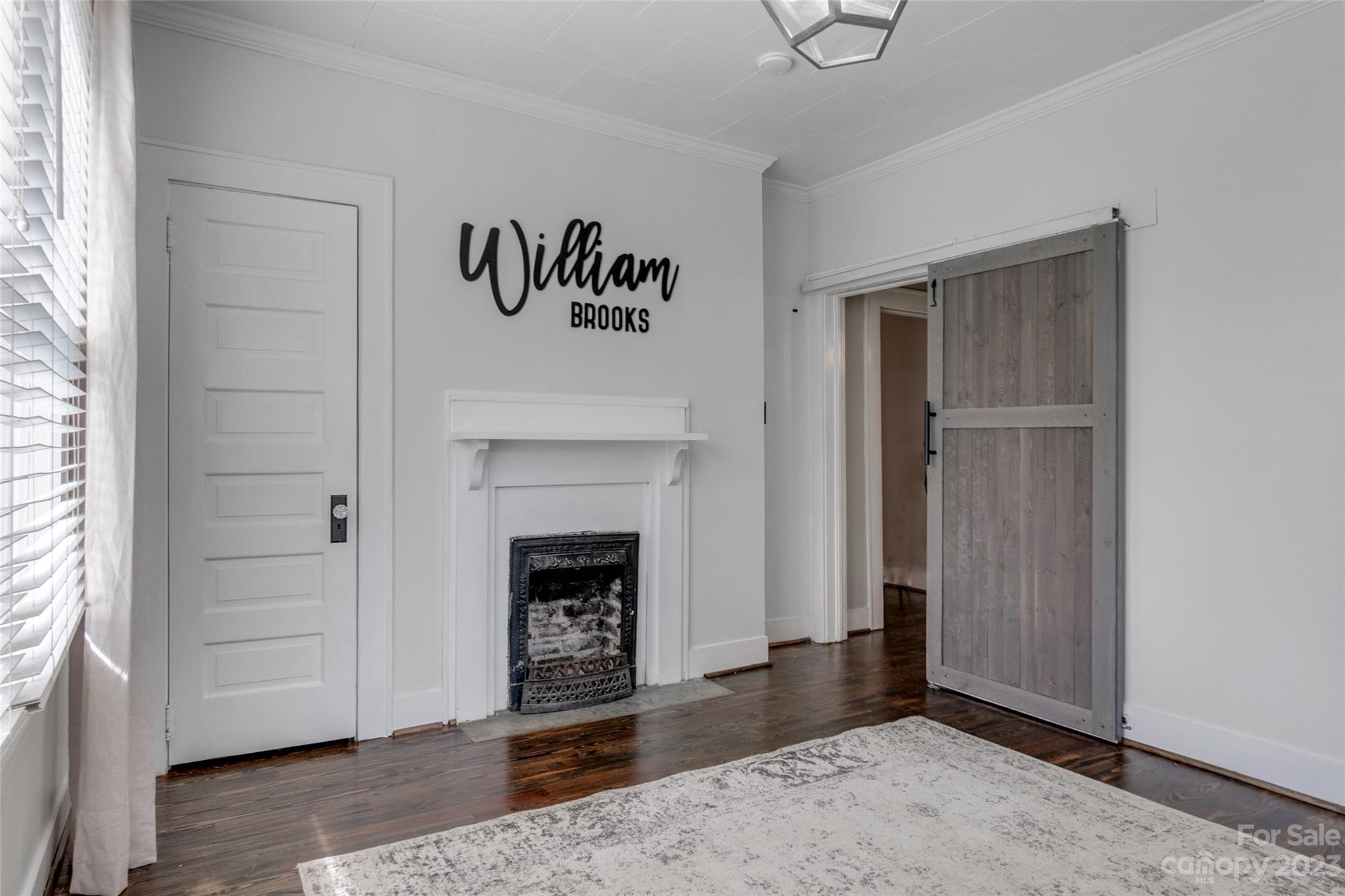 102 Grier Street Fort Mill, SC 29715 - Photo 21 of 47 a view of empty room with window and fireplace