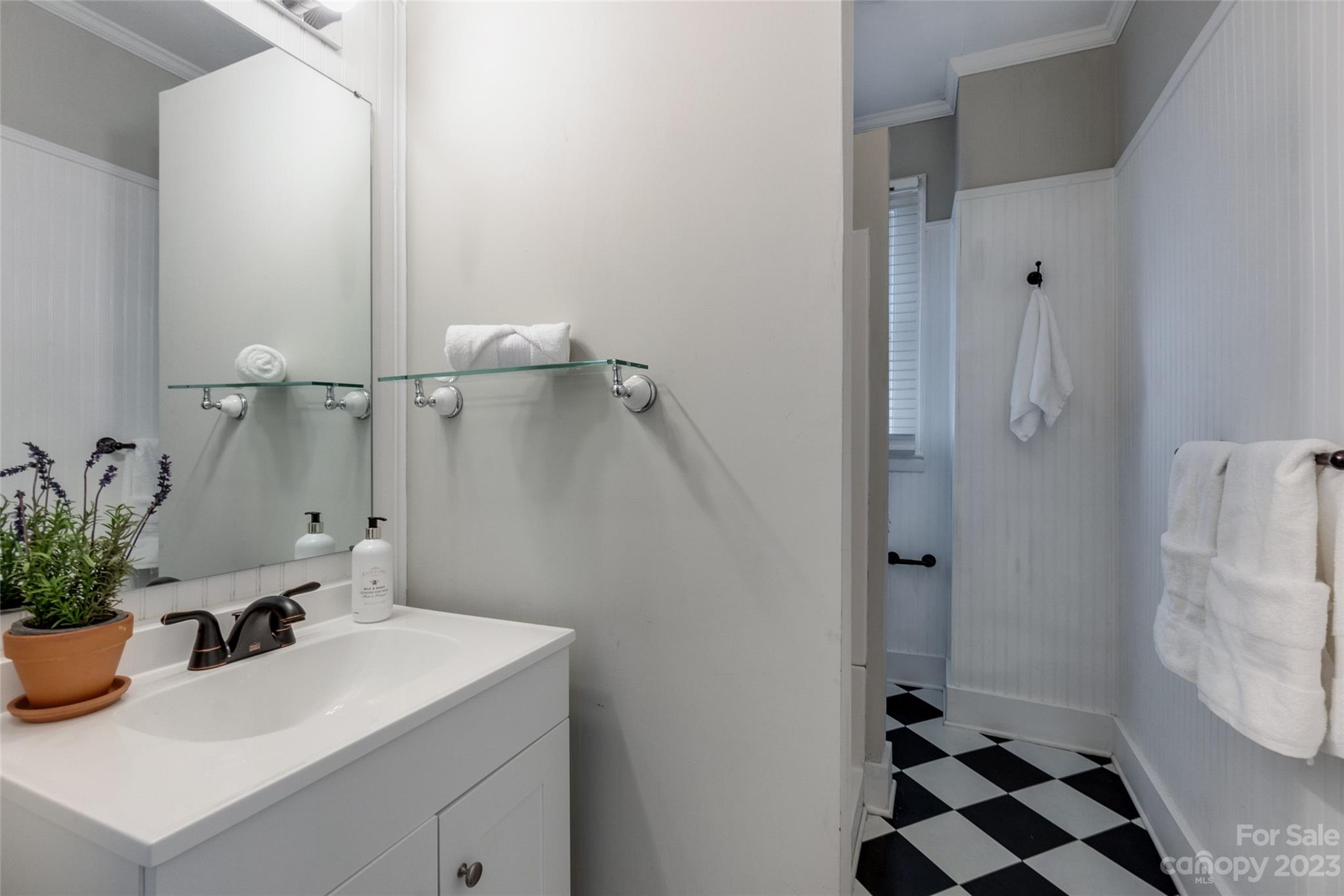 102 Grier Street Fort Mill, SC 29715 - Photo 24 of 47 a bathroom with a sink a mirror and shower