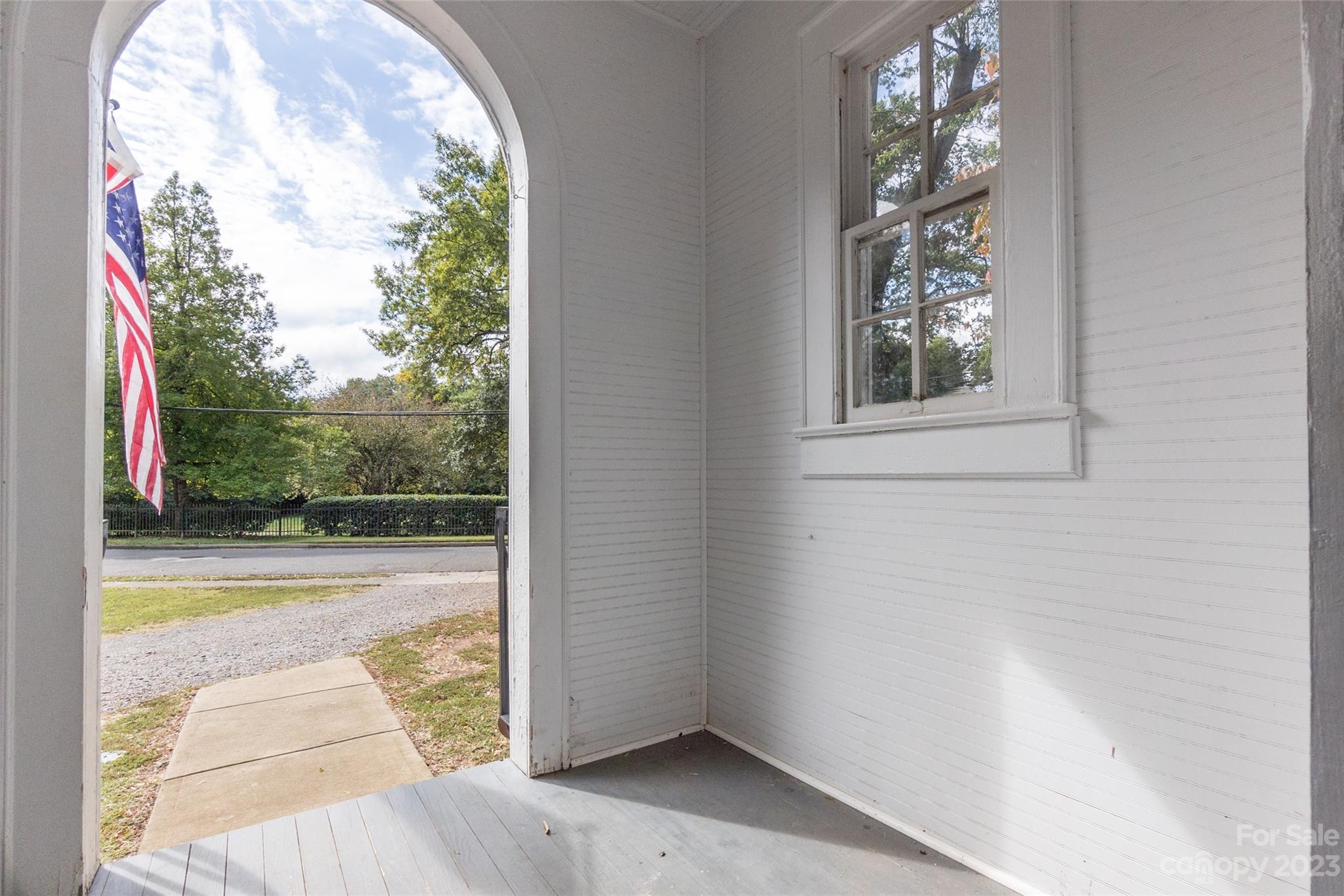 102 Grier Street Fort Mill, SC 29715 - Photo 3 of 47 view of empty room with floor to ceiling window and tree