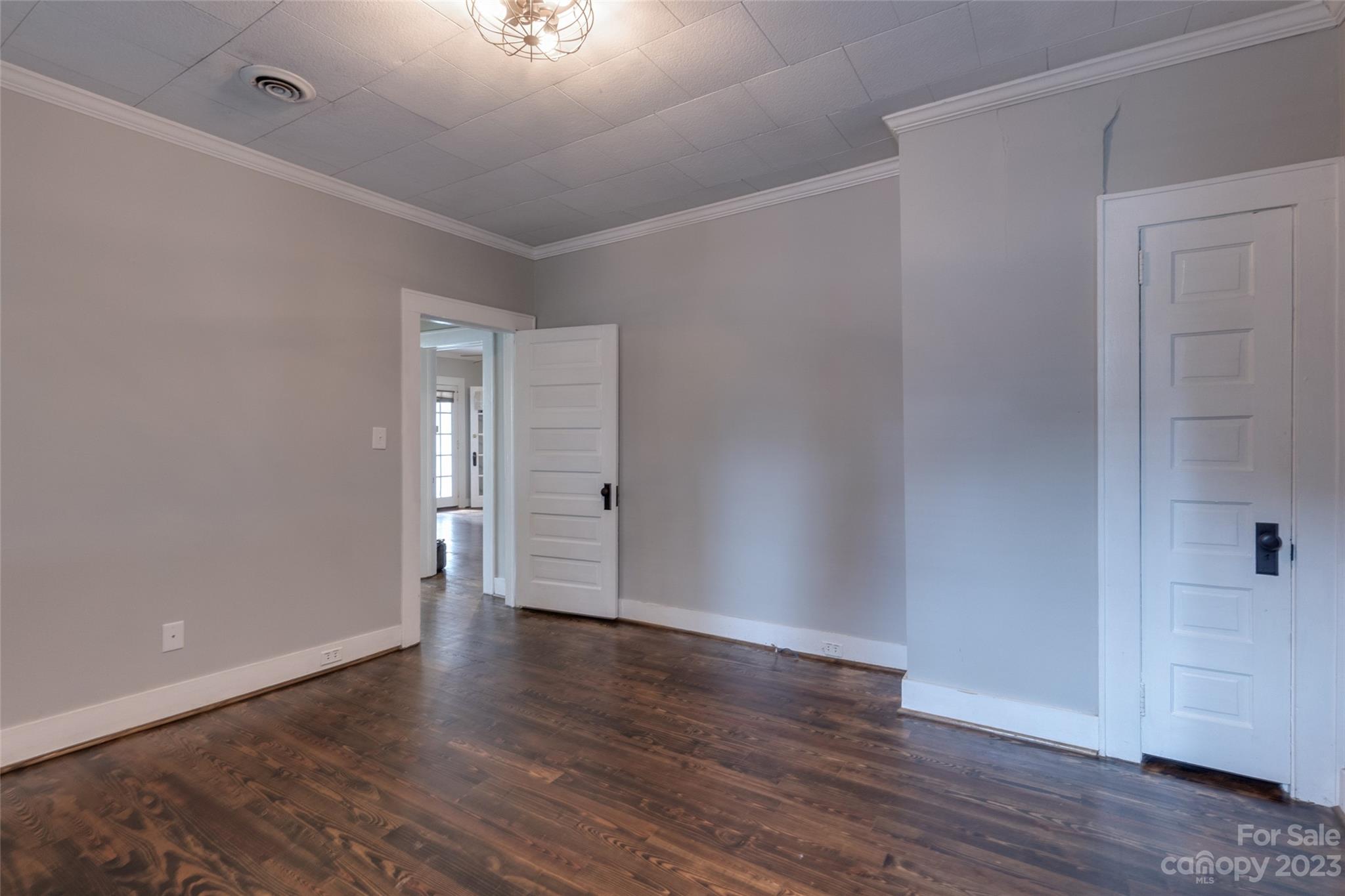 102 Grier Street Fort Mill, SC 29715 - Photo 31 of 47 a view of an empty room with wooden floor and a window