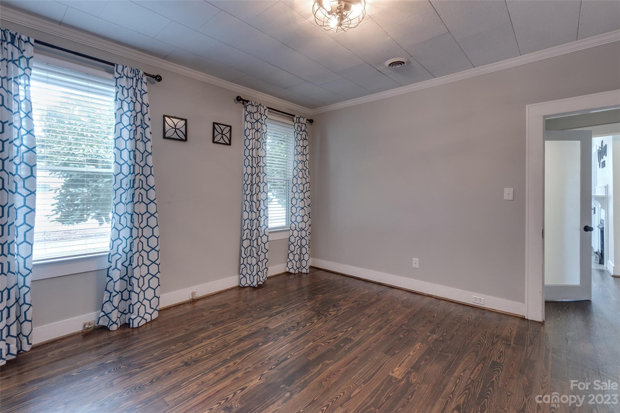 102 Grier Street Fort Mill, SC 29715 - Photo 32 of 47 a view of an empty room with wooden floor and a window