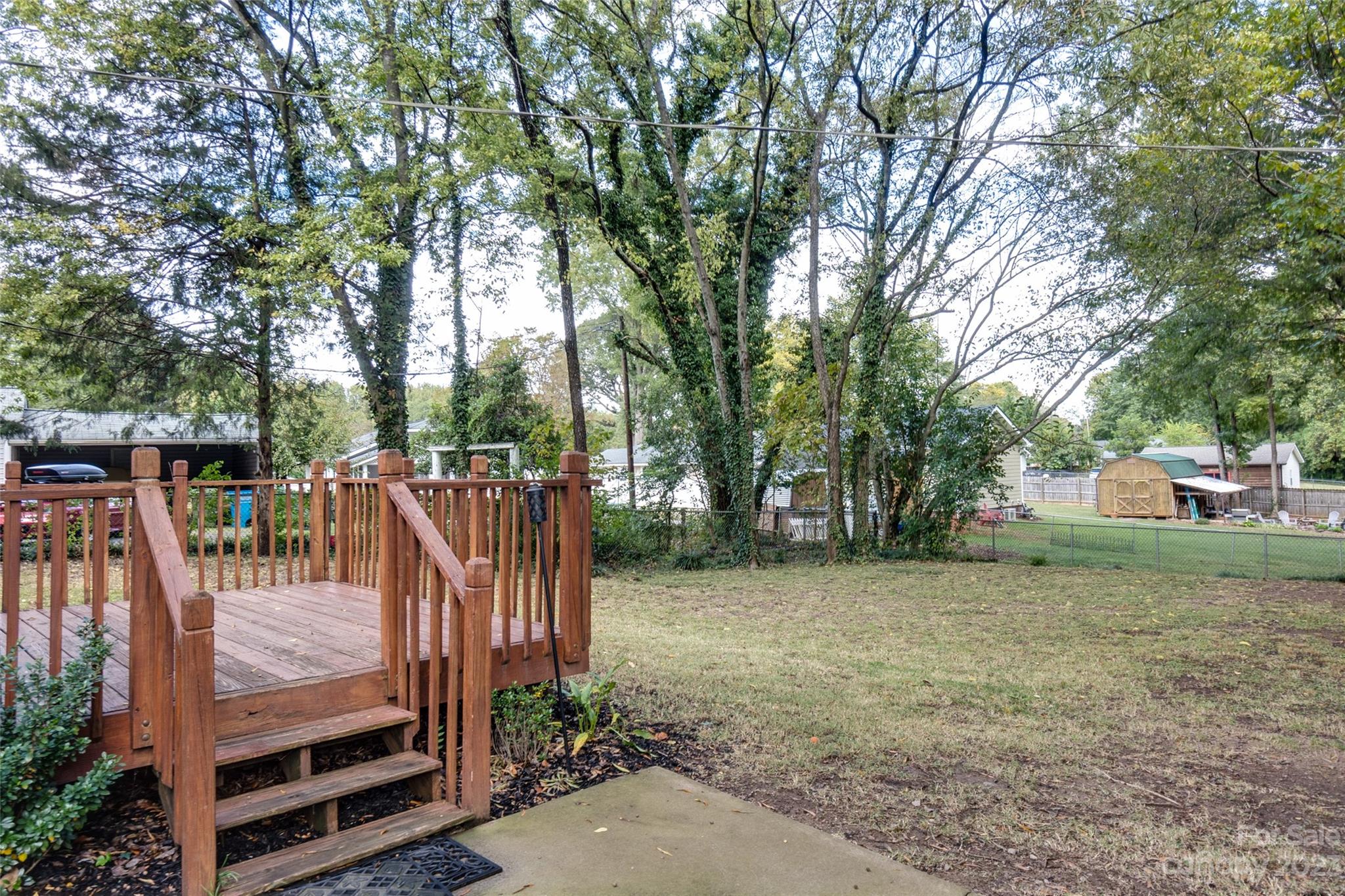 102 Grier Street Fort Mill, SC 29715 - Photo 36 of 47 a view of a backyard with wooden fence