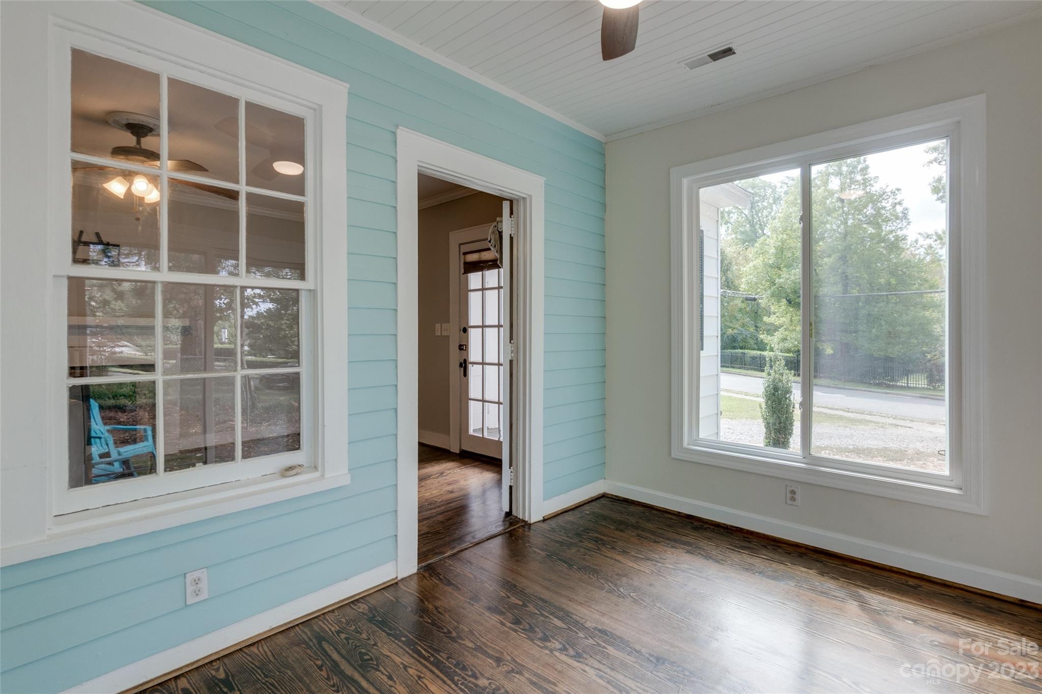102 Grier Street Fort Mill, SC 29715 - Photo 10 of 47 a view of an empty room with wooden floor and windows