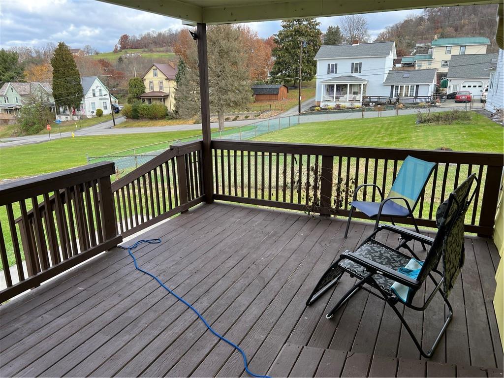 939 Orchard Street Rochester, PA 15074 - Photo 3 of 9 a view of a wooden deck with a yard