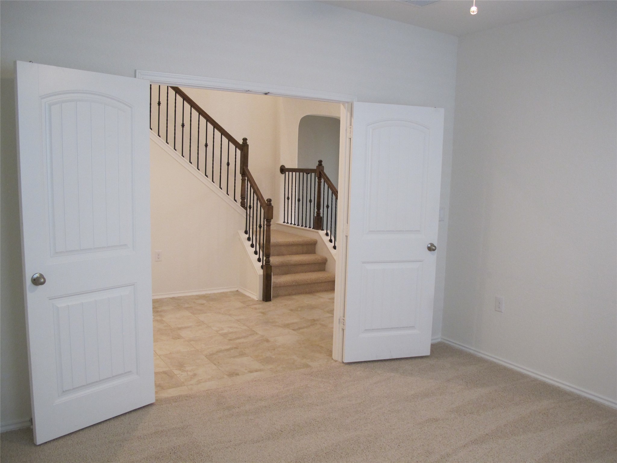7820 Big Wind Way Austin, TX 78724 - Photo 18 of 37 Empty room featuring stairs and light carpet