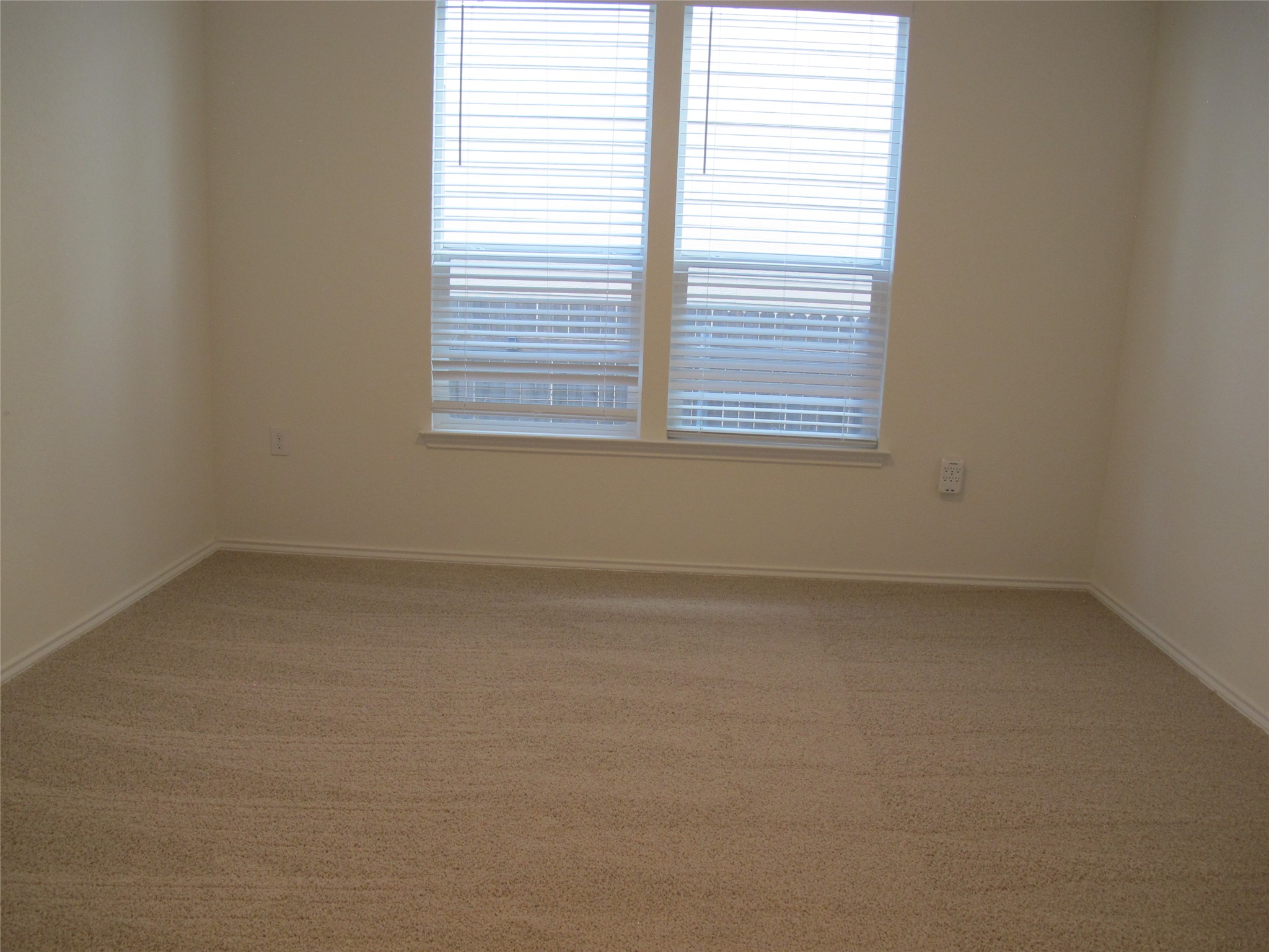 7820 Big Wind Way Austin, TX 78724 - Photo 19 of 37 Unfurnished room featuring light colored carpet