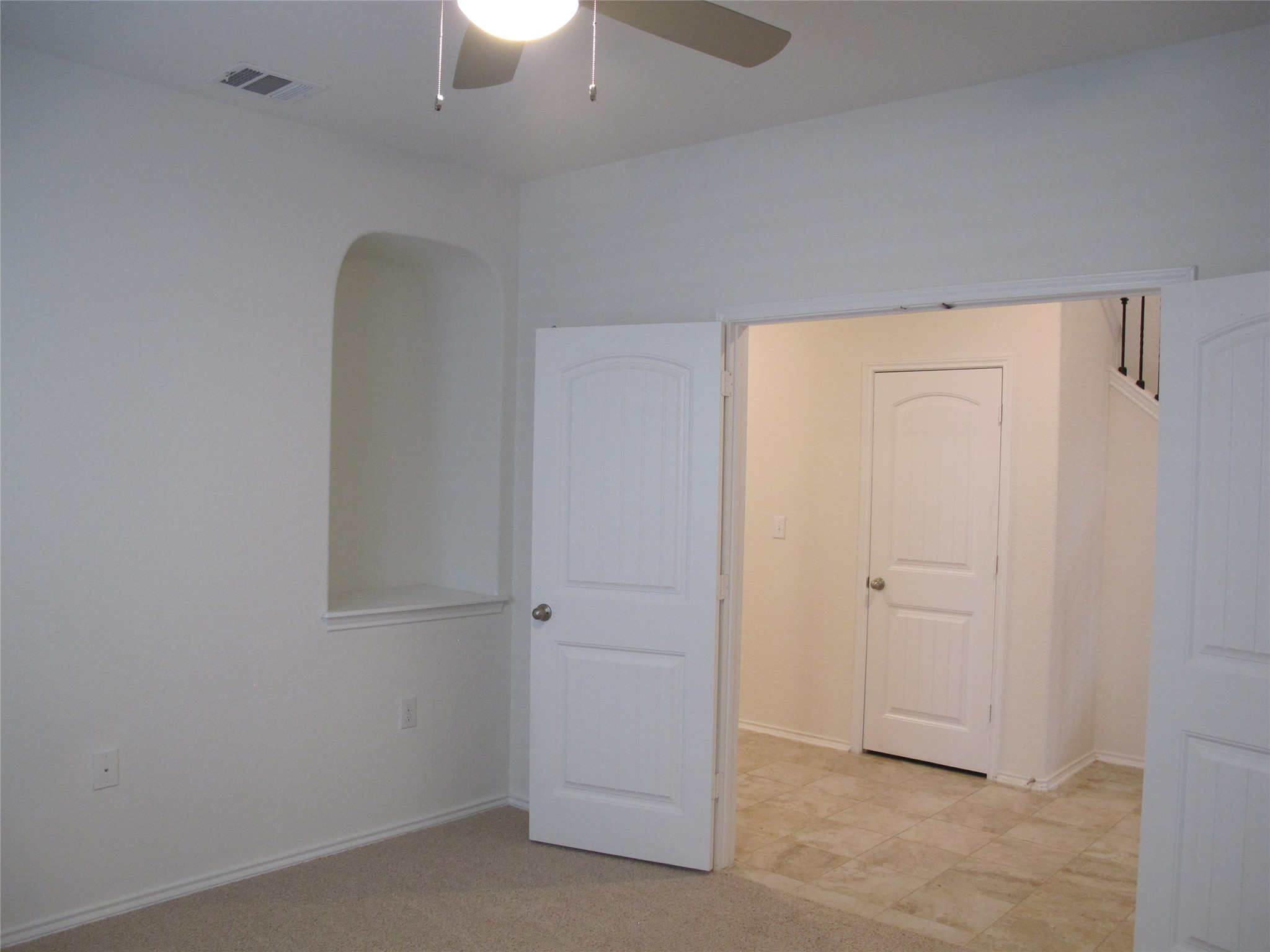 7820 Big Wind Way Austin, TX 78724 - Photo 20 of 37 Unfurnished bedroom featuring light colored carpet and ceiling fan