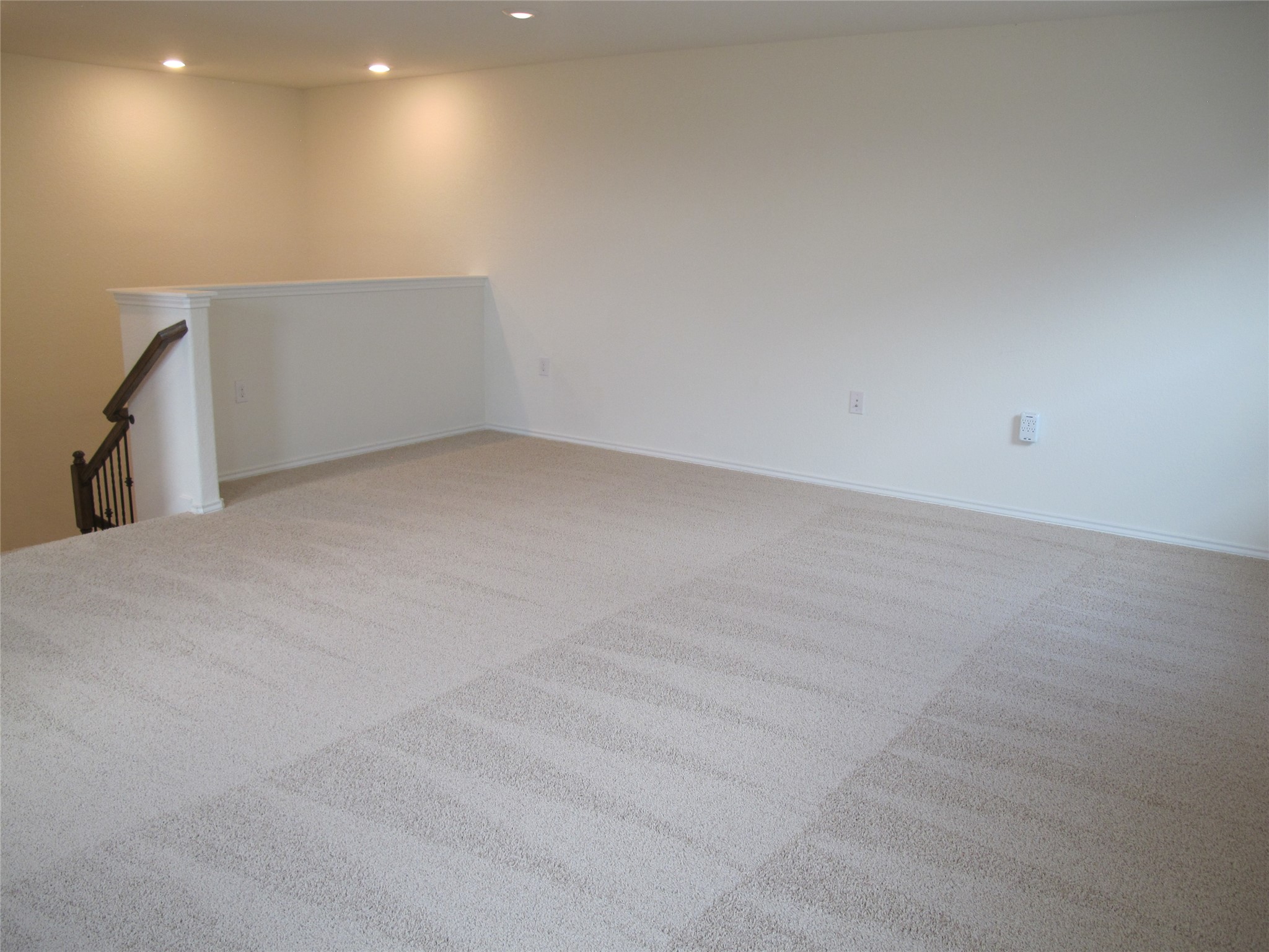 7820 Big Wind Way Austin, TX 78724 - Photo 28 of 37 Unfurnished room with light carpet and recessed lighting