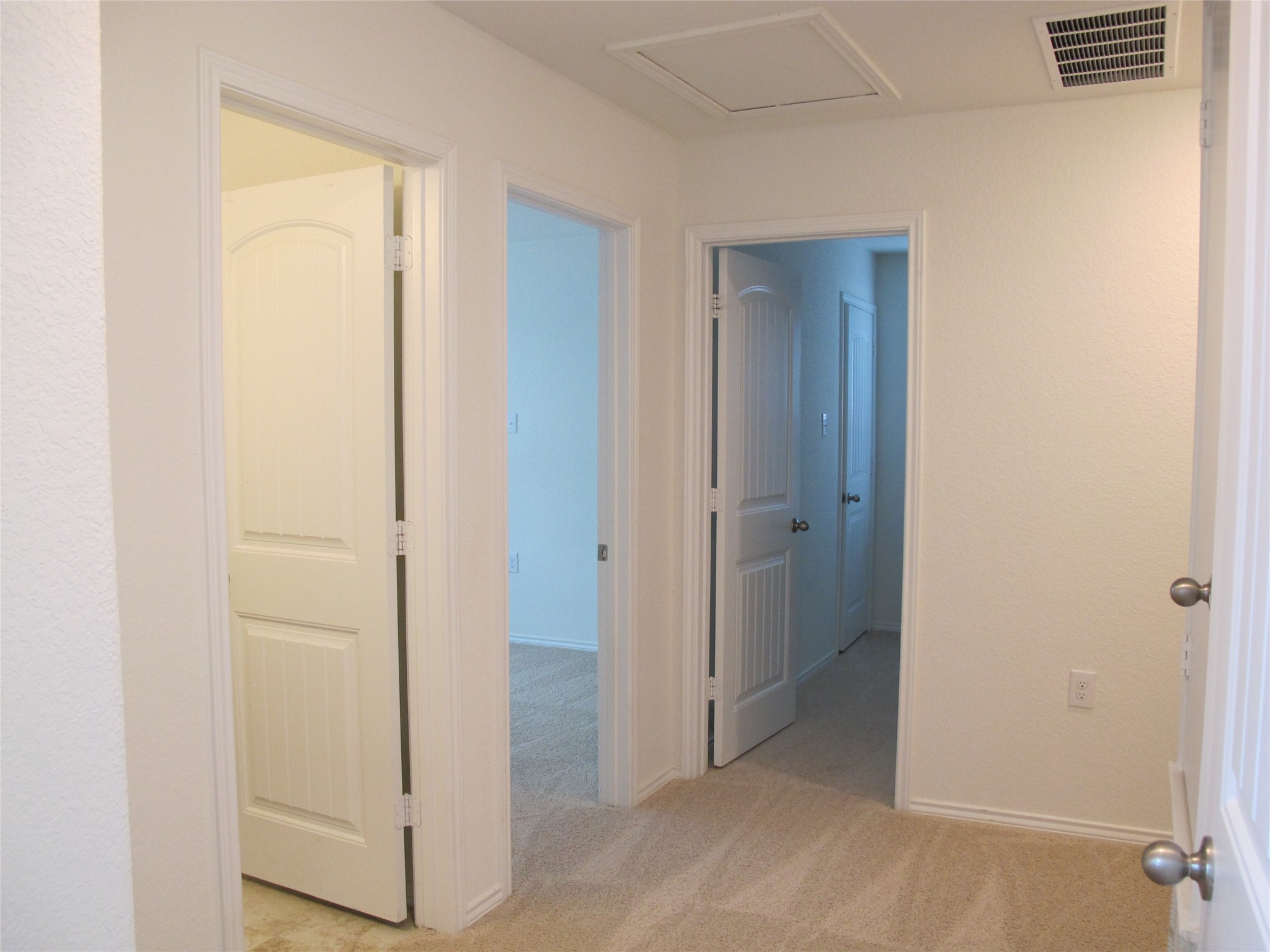 7820 Big Wind Way Austin, TX 78724 - Photo 29 of 37 Corridor with light colored carpet and baseboards