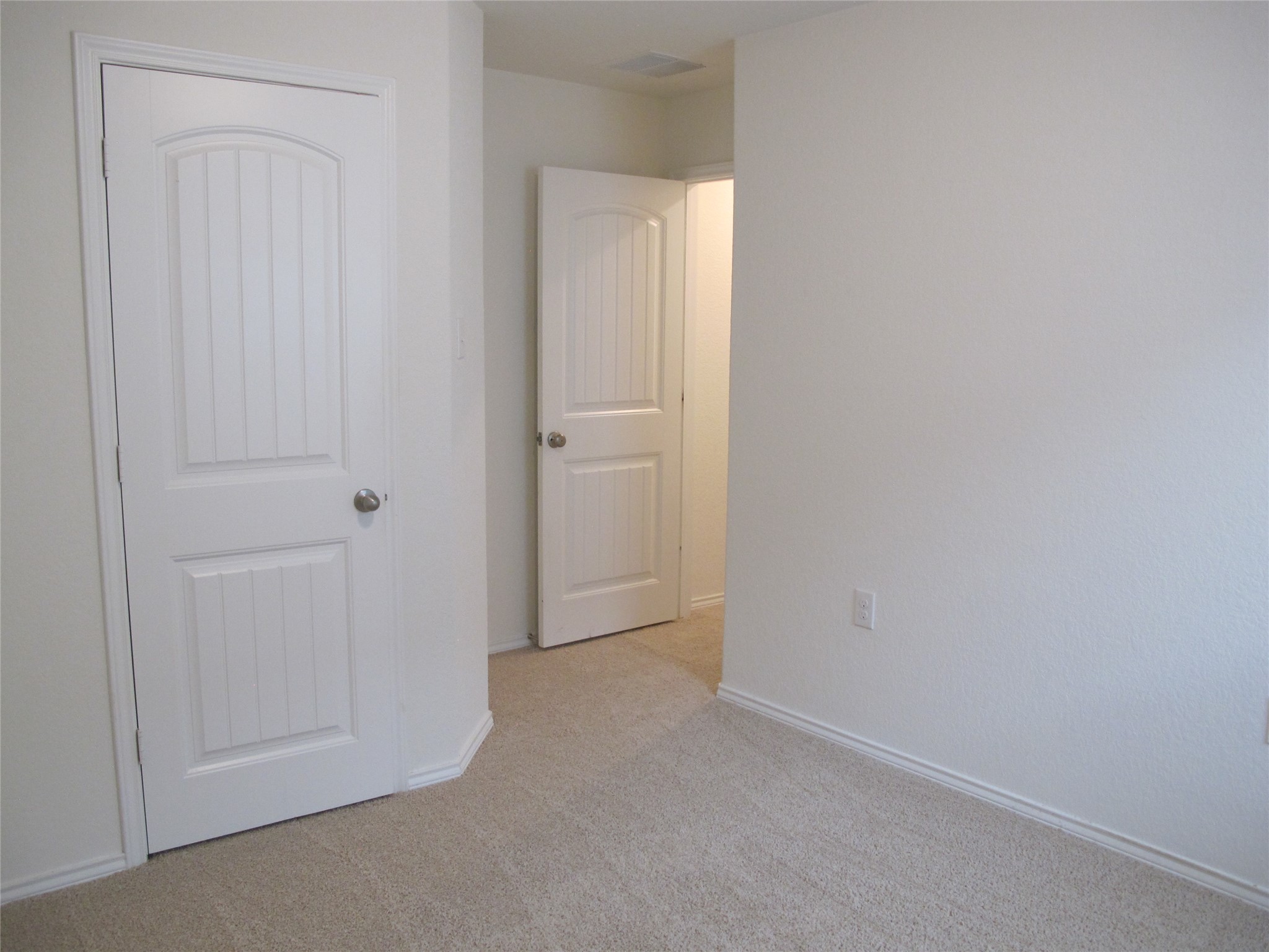 7820 Big Wind Way Austin, TX 78724 - Photo 33 of 37 Unfurnished bedroom with light colored carpet and baseboards