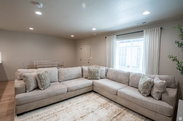 1787 North 1280 East Payson, UT 84651 - Photo 5 of 22 Open-concept living area featuring light-toned walls, recessed lighting, and wood-finish flooring