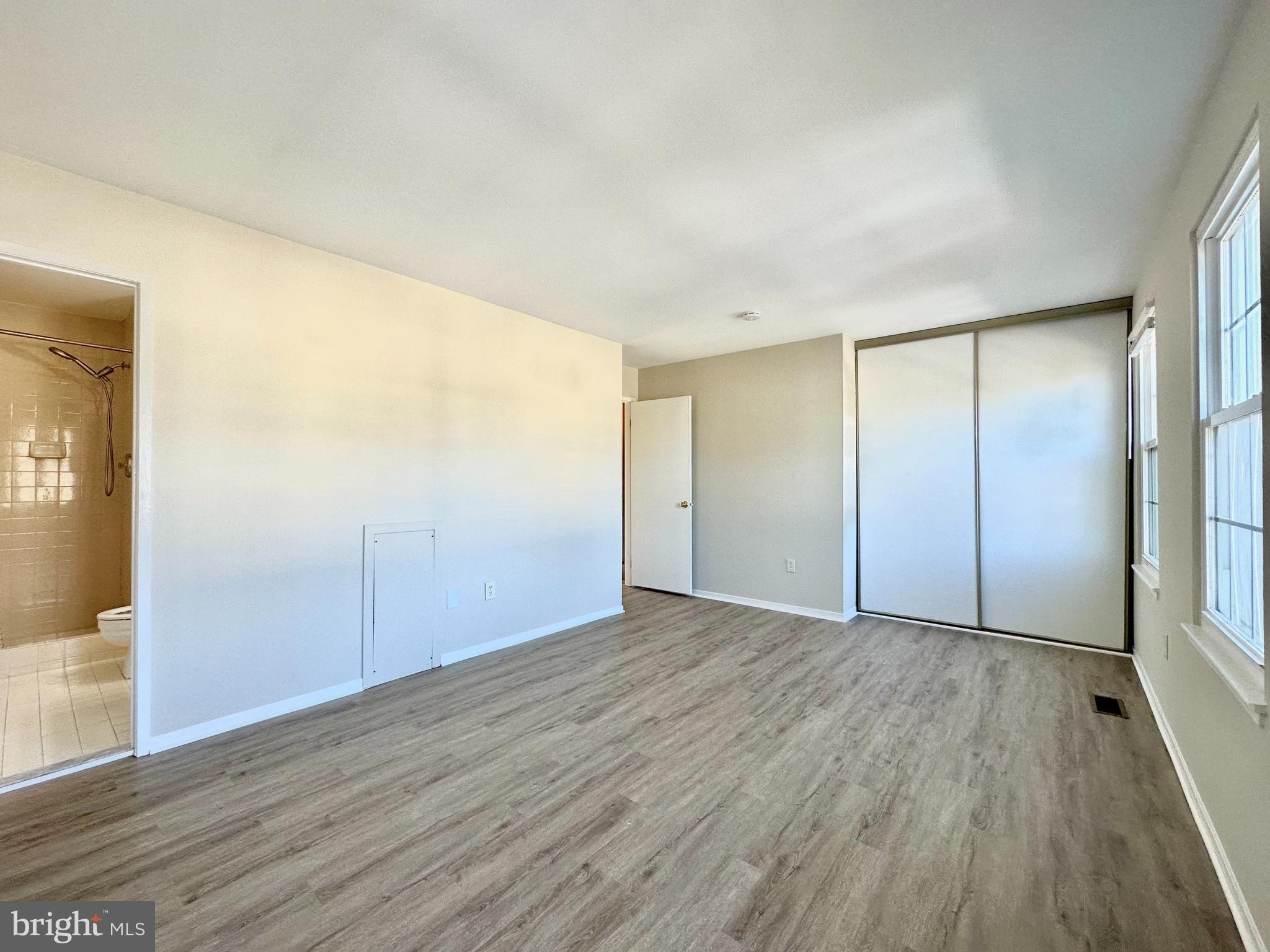 402 Carousel Court Gaithersburg, MD 20877 - Photo 18 of 29 a view of an empty room with wooden floor