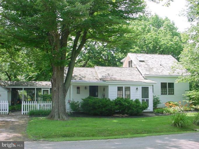 23005 Carrollton Road Neavitt, MD 21652 - Photo 1 of 21 a front view of a house with a yard