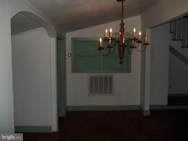 23005 Carrollton Road Neavitt, MD 21652 - Photo 13 of 21 a view of a dining room with furniture and chandelier