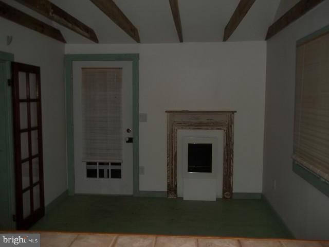 23005 Carrollton Road Neavitt, MD 21652 - Photo 8 of 21 a view of a livingroom with an empty space and a fireplace