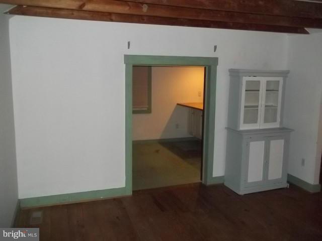 23005 Carrollton Road Neavitt, MD 21652 - Photo 10 of 21 a view of a hallway with wooden floor and a cabinet