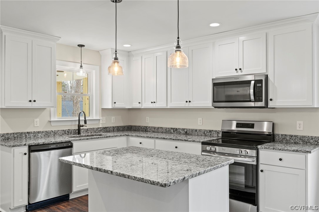 1548 Cartersville Road Goochland, VA 23063 - Photo 11 of 33 a kitchen with stainless steel appliances granite countertop a sink a stove and a granite counter tops