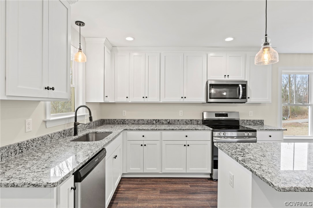 1548 Cartersville Road Goochland, VA 23063 - Photo 12 of 33 a kitchen with granite countertop white cabinets white appliances and granite counter tops