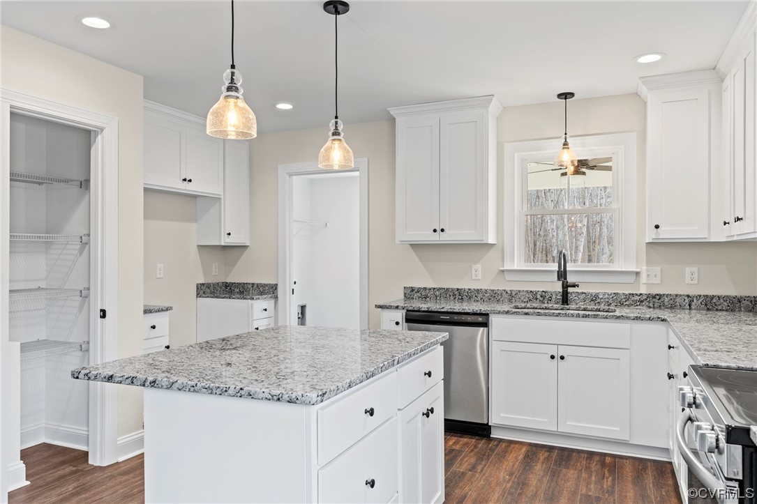 1548 Cartersville Road Goochland, VA 23063 - Photo 13 of 33 a kitchen with stainless steel appliances granite countertop a sink a stove a refrigerator and white cabinets
