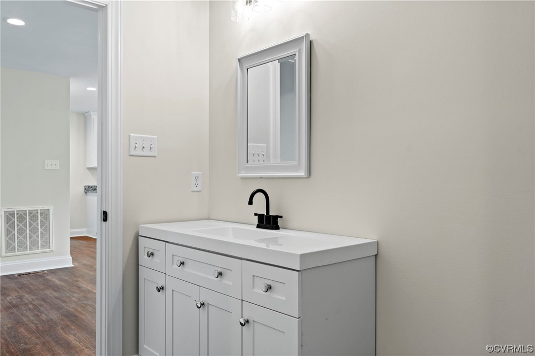 1548 Cartersville Road Goochland, VA 23063 - Photo 18 of 33 a bathroom with a sink vanity and a mirror