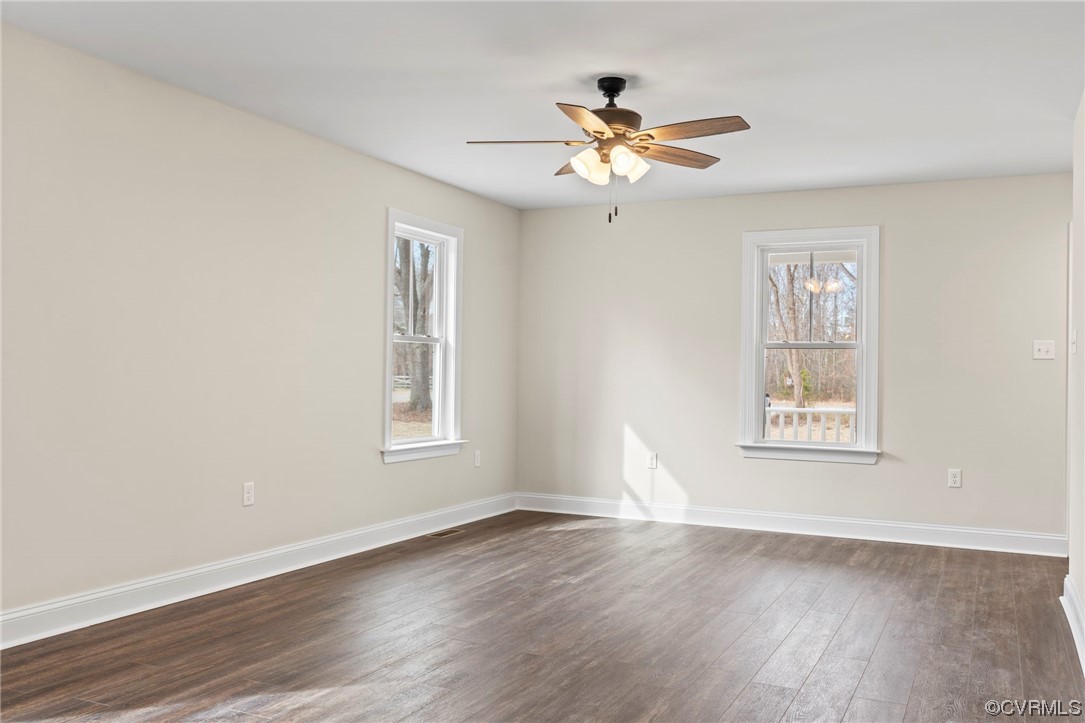 1548 Cartersville Road Goochland, VA 23063 - Photo 23 of 33 a view of an empty room with wooden floor and a window