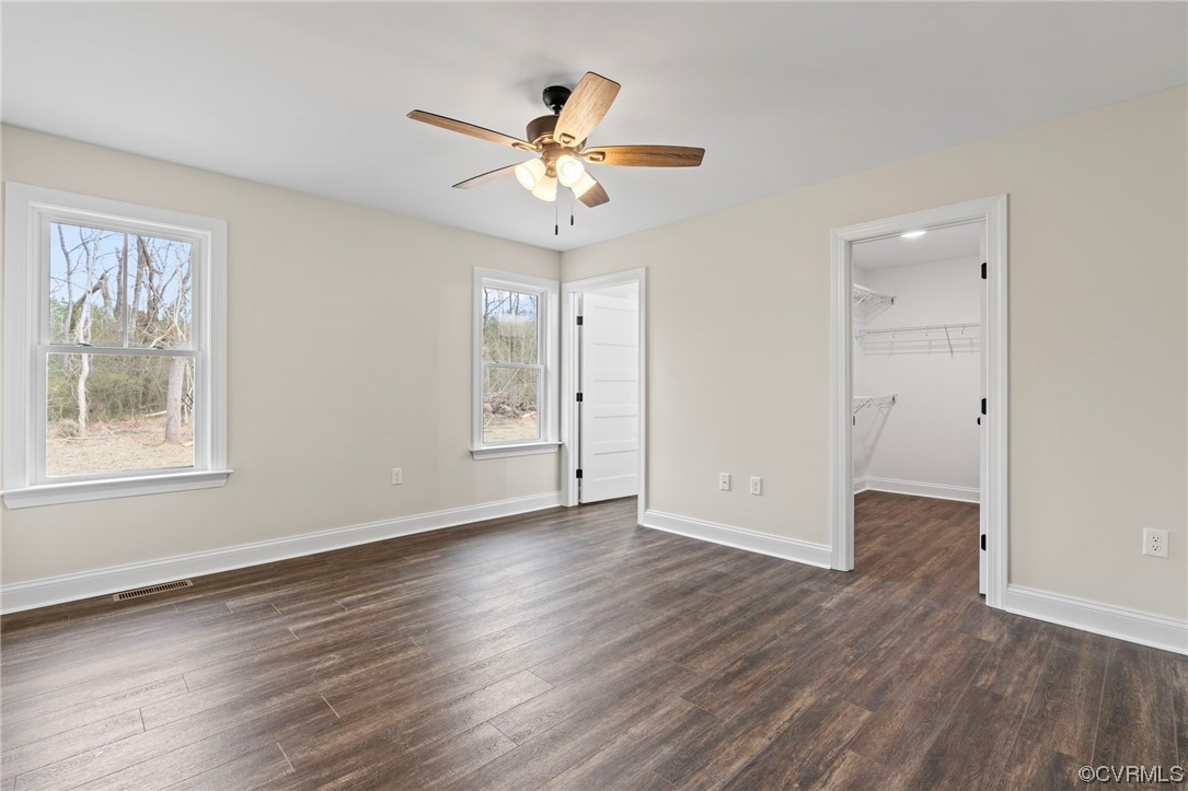 1548 Cartersville Road Goochland, VA 23063 - Photo 24 of 33 a view of an empty room with wooden floor and a window