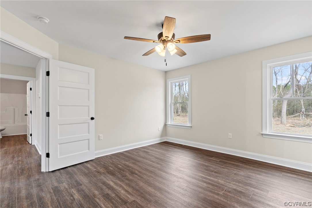 1548 Cartersville Road Goochland, VA 23063 - Photo 28 of 33 a view of an empty room with wooden floor and a window