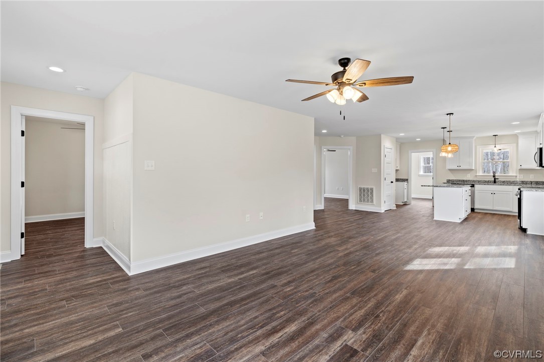 1548 Cartersville Road Goochland, VA 23063 - Photo 5 of 33 a view of a kitchen with wooden floor and a ceiling fan