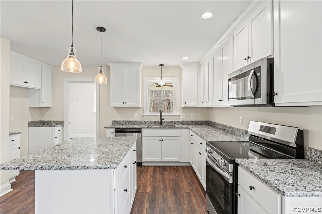 1548 Cartersville Road Goochland, VA 23063 - Photo 10 of 33 a kitchen with granite countertop stainless steel appliances a sink stove and cabinets