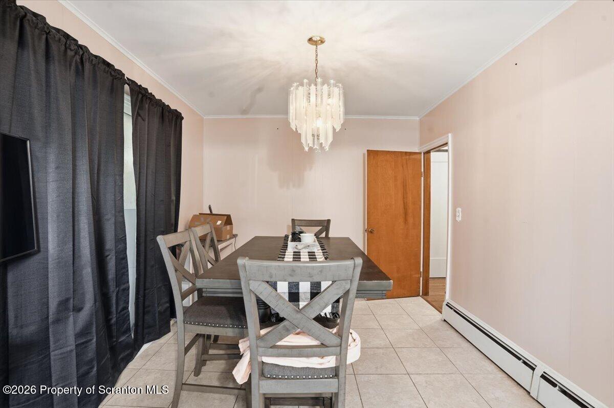 101 Stone Street Moosic, PA 18507 - Photo 13 of 53 a view of a dining room with furniture and a chandelier